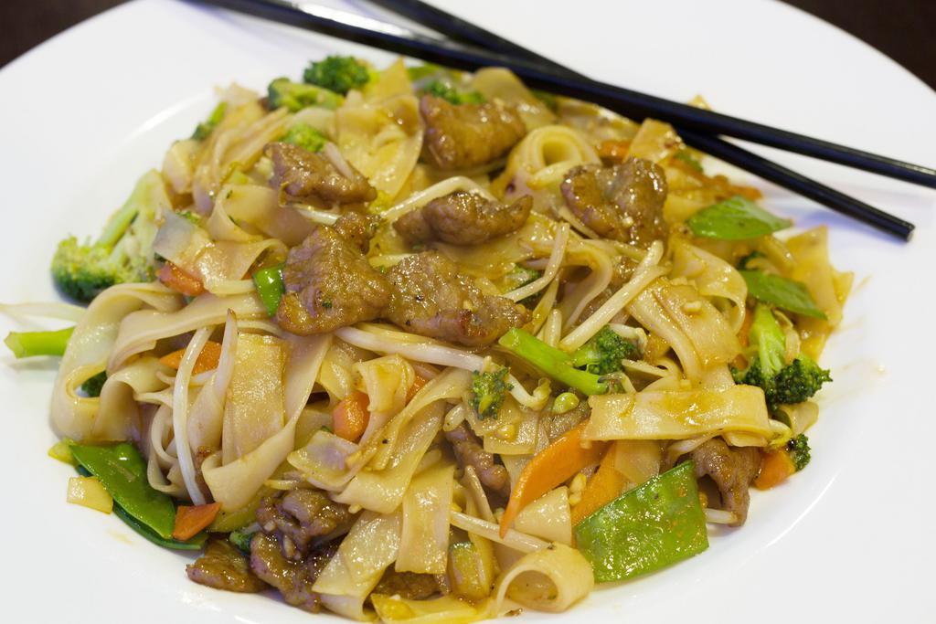 21. Chow Fun Noodle · Pan-fried smoked soft flat noodles topped with bean sprouts, carrots, broccoli, snow peas, zucchini, and onions with light brown sauce.