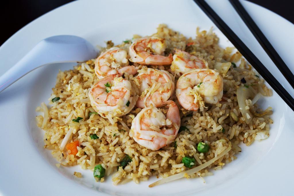 23. Fried Rice · Fried rice with bean sprouts, peas, onions, diced carrots, and egg.