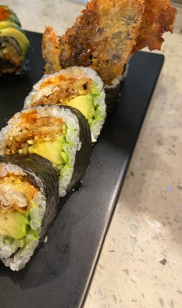 R13. Spider Roll · Inside: Soft shell crab and cucumber. Outside: Avocado, masago and mayo. Sauce: Eel sauce.