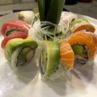 R23. Rainbow Roll · Inside: Kani cucumber and avocado. Outside: Tuna, salmon, yellowtail and white fish.