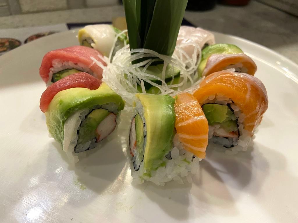 R23. Rainbow Roll · Inside: Kani cucumber and avocado. Outside: Tuna, salmon, yellowtail and white fish.