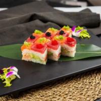 R24. Rectangle Roll · Inside: Lobster salad, avocado and crabstick. Outside: Tuna, salmon, scallions and black tob...