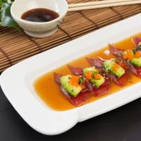 U8. Tuna Tataki · Sliced seared tuna, onion, avocado, scallion and masago. Served with ponzu sauce.