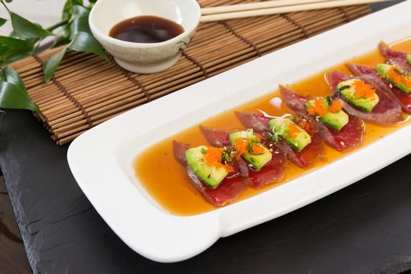 U8. Tuna Tataki · Sliced seared tuna, onion, avocado, scallion and masago. Served with ponzu sauce.