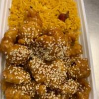 1. Sesame Chicken 芝麻鸡 · Chunks of boneless white meat chicken, sautéed in a special sweet and sour brown sauce, surr...