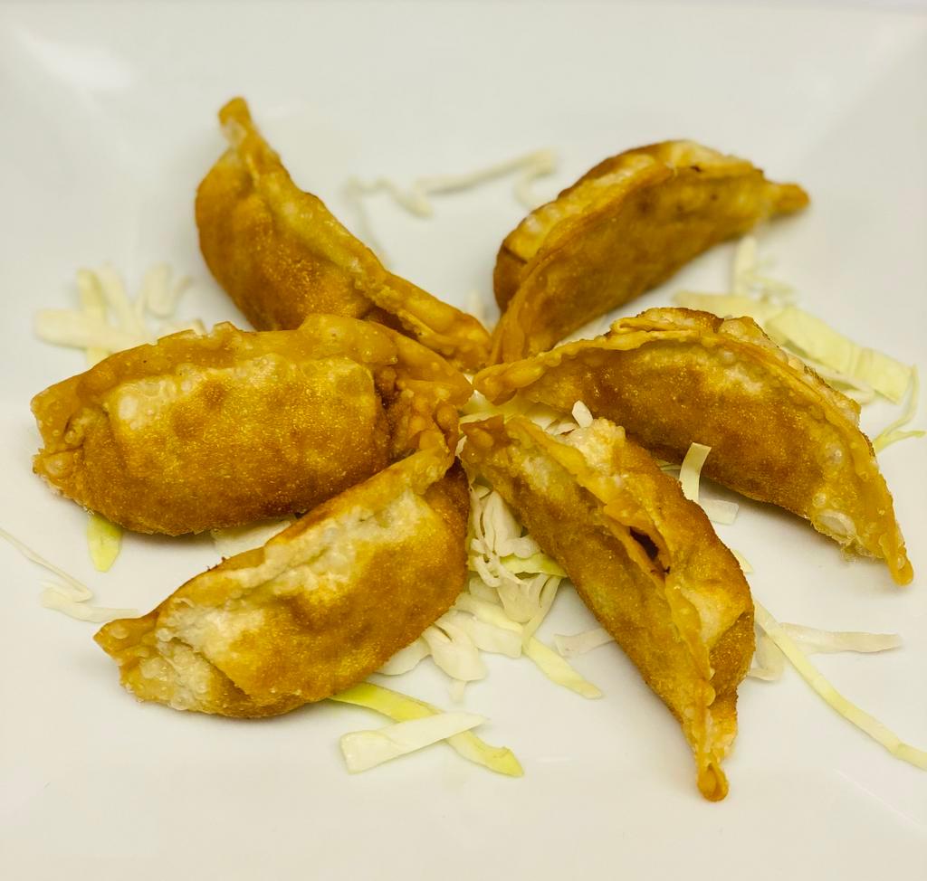 Chicken Gyoza (6 pcs) · Dumpling with a minced filling. 