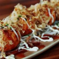 Takoyaki (6pcs) · A small & round flavored batter filling with a little diced of octopus topped with spicy may...