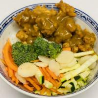 Chicken Karaage Curry Bowl · Coated & fried boneless dark meat chicken with steamed veggies over steamed rice, topped wit...