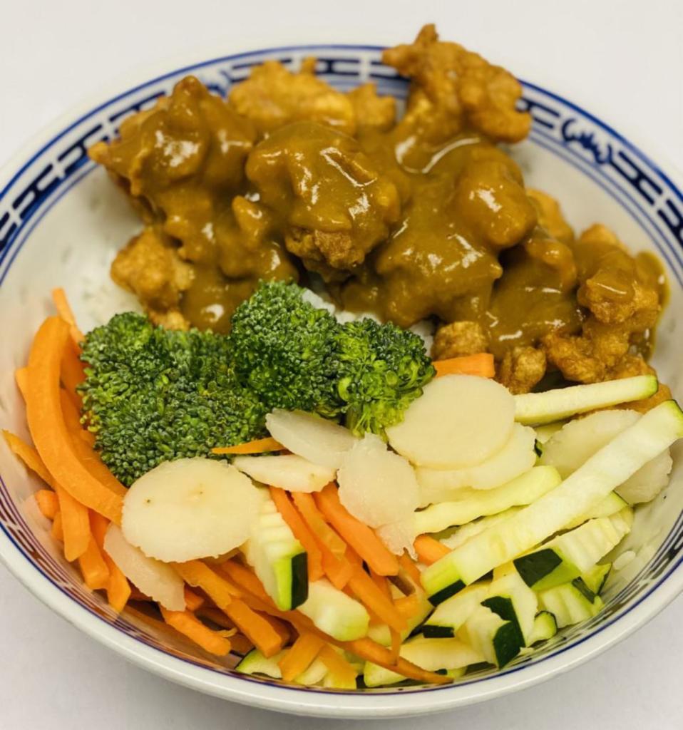 Chicken Karaage Curry Bowl · Coated & fried boneless dark meat chicken with steamed veggies over steamed rice, topped with japanese curry sauce.
Served with house salad & miso soup