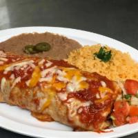 Burrito Supreme · 12” flour tortilla stuffed with steak and chicken, beans, rice, lettuce and pico de gallo, s...