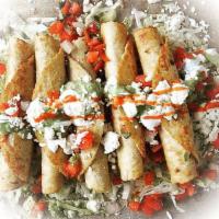 Flautas · 4 fried corn tortillas filled with shredded chicken or shredded beef. Served with lettuce, p...