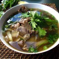 Beef Pho · Traditional beef broth simmered with onions and ginger charred over an open flame and pan-to...