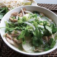 Chicken Pho · Traditional chicken broth, onions, ginger and pan toasted spices. Served with a plate of her...