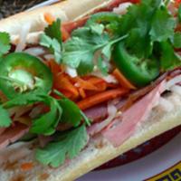 Classic Banh Mi Sandwich · Ham, head cheese, pork roll and pate. Dressed with a tangy carrot and daikon relish, cucumbe...