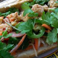 Lemongrass Tofu Banh Mi Sandwich · Dressed with a tangy carrot and daikon relish, cucumbers, jalapenos, cilantro and mayo on a ...