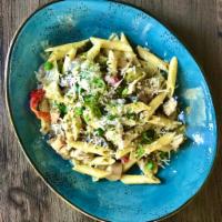 Penne Pasta · Served with grilled chicken, sun dried tomatoes, fresh basil, parmesan cream sauce