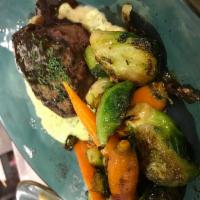 Grilled Filet of Beef  · 8oz hand cut Filet grilled to order. Served over a bed of roasted shallot mashed potatoes wi...