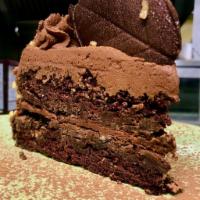 BLACKOUT CHOCOLATE CAKE · layered chocolate cake, pecans, topped with chocolate mousse