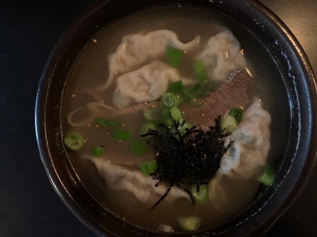 Man Du Guk · Dumpling soup with scallions, eggs, dried seaweed flakes and glass noodles.