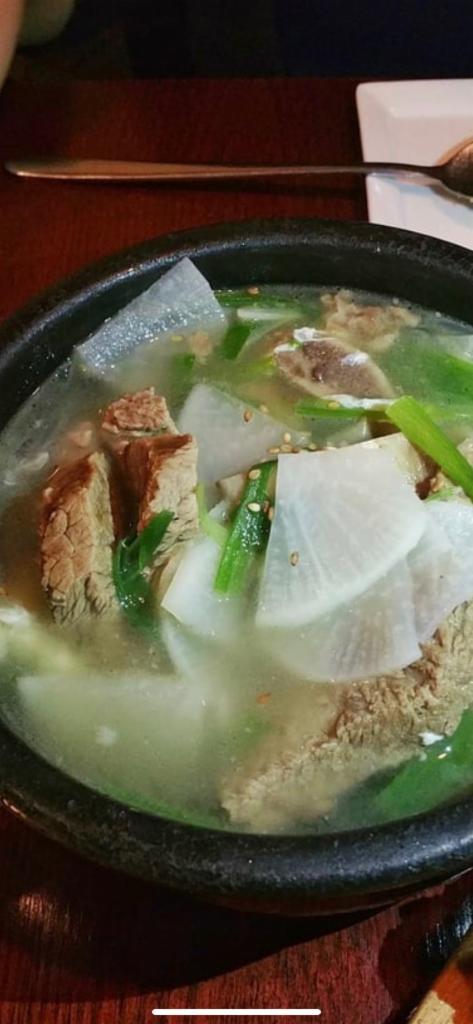 Gal Bi Tang · Short rib soup with radishes, scallions, eggs and glass noodles.