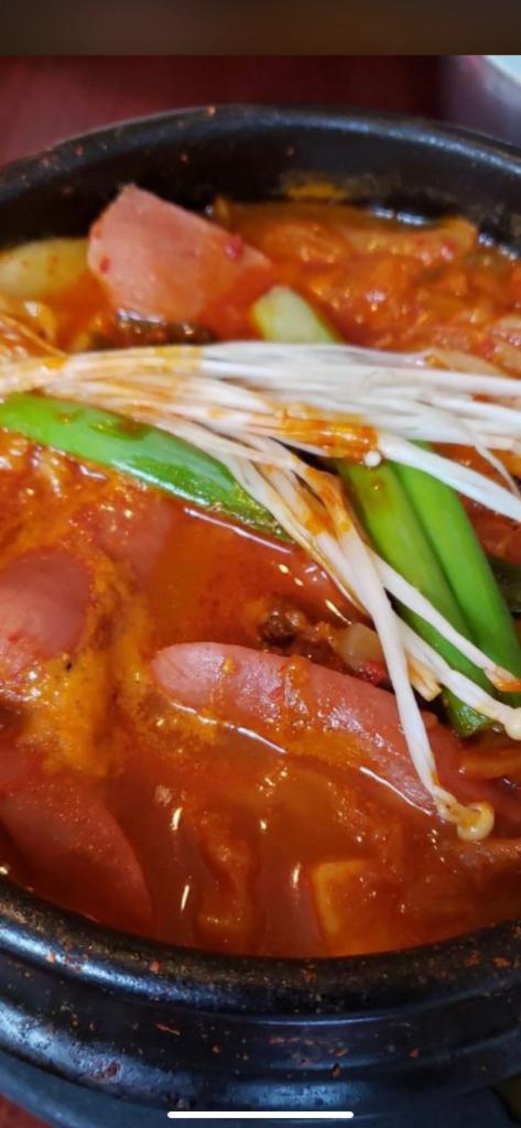 Bu Dae JjiGae · Army base stew. Ham and sausage stew with kimchi, tofu, rice cake and ramen noodles. Spicy.