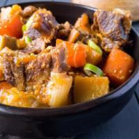 Gal Bi Jjim · Braised short rib stew with carrots, radishes and pearl onions.