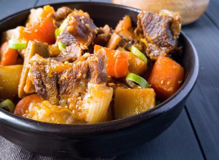Gal Bi Jjim · Braised short rib stew with carrots, radishes and pearl onions.