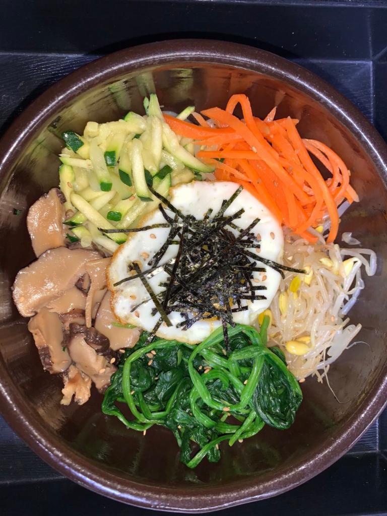 BiBimBap · Assorted vegetables & fried egg. Served with rice and go Chuang sauce