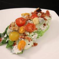 Romaine Wedge Salad Dinner · Romaine hearts, tomato, cucumbers, bacon, croutons and blue cheese dressing.