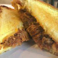 Pulled Pork Grilled Cheese · This is grilled cheese taken to the next level. Tender Pulled Pork smothered in BBQ sauce an...