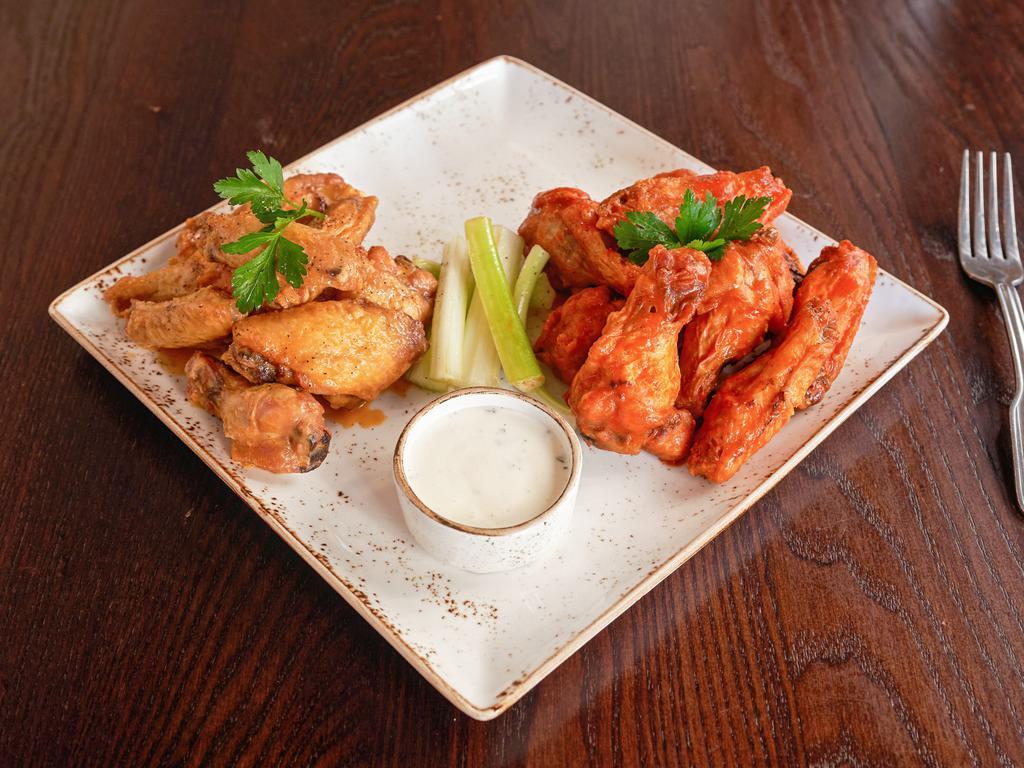 Forchetta Wings · 8 jumbo wings, bleu cheese celery sticks, choice of traditional Buffalo sauce or coconut and red curry sauce. 