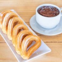 Chocolate con Churros · Hot chocolate with 6 units of Spanish fritters.