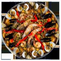 Paella Valenciana · Para 2 personas. No lieva acomananta. Yellow rice with seafood and chicken for 2 people. No ...