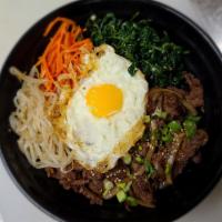 B2. Korean Rice Bowl · Chicken or beef mix with carrot, spinach, bean sprouts and sesame seed with sunrise egg.