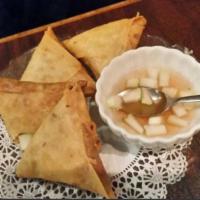 Curry Puffs · Chicken, sweet potato, onion and curry powder in crispy rice paper. Served with cucumber sau...