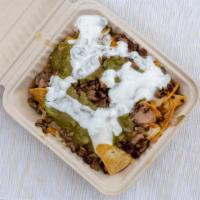 Nachos With Meat · Tortilla chips, your choice of meat, refried beans, melted white cheese, sour cream, guacamo...
