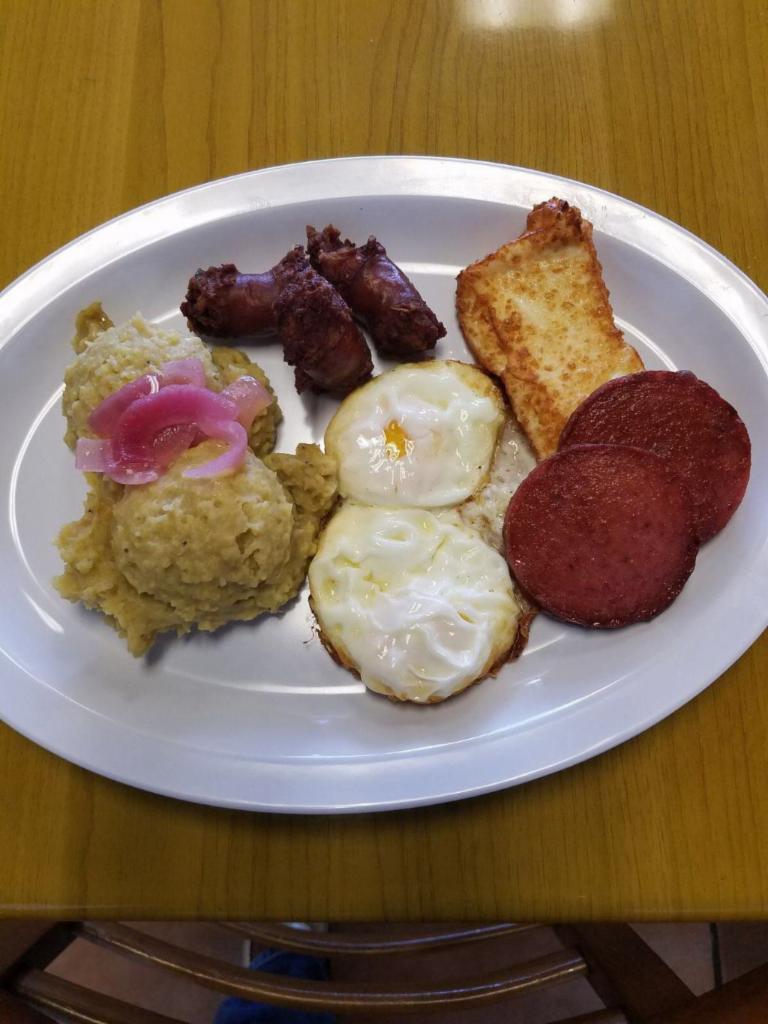 Mangu Golpes with 4 Accompaniments · Smashed green plantains with 4 accompaniments.