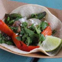 #6. Rajas Taco · Grilled Poblanos, mushrooms, onions and red peppers topped with queso fresco and cilantro. S...