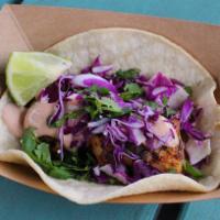 #7. Fish Taco · Grilled or fried with baja sauce, red cabbage and cilantro. Served on a corn tortilla.