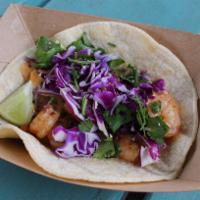 #8. Baja Shrimp Taco · Crispy or grilled shrimp with creamy baja sauce, red cabbage and cilantro. Served on a corn ...