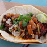 #9. Rusty Taco · Achiote pork with pineapple, onion and cilantro. Served on a corn tortilla.