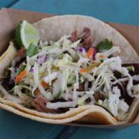 #11. BBQ Brisket Taco · Brisket with BBQ sauce and slaw. Served on a corn tortilla.