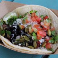 #12. Black Bean Taco · Chipotle black beans with pico de gallo, Cotija cheese, cilantro and toasted pumpkin seeds. ...