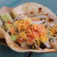 #13. Texican Taco · Tex Mex beef, lettuce, tomato and cheese. Served on a corn tortilla.