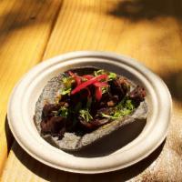 Carne Asada Taco GH · grilled steak, cilantro, salsa roja and pickled onions