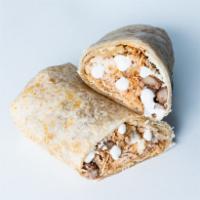 Pollo Tinga Burrito · Chipotle shredded chicken, rice, beans, sour cream and Cotija cheese.