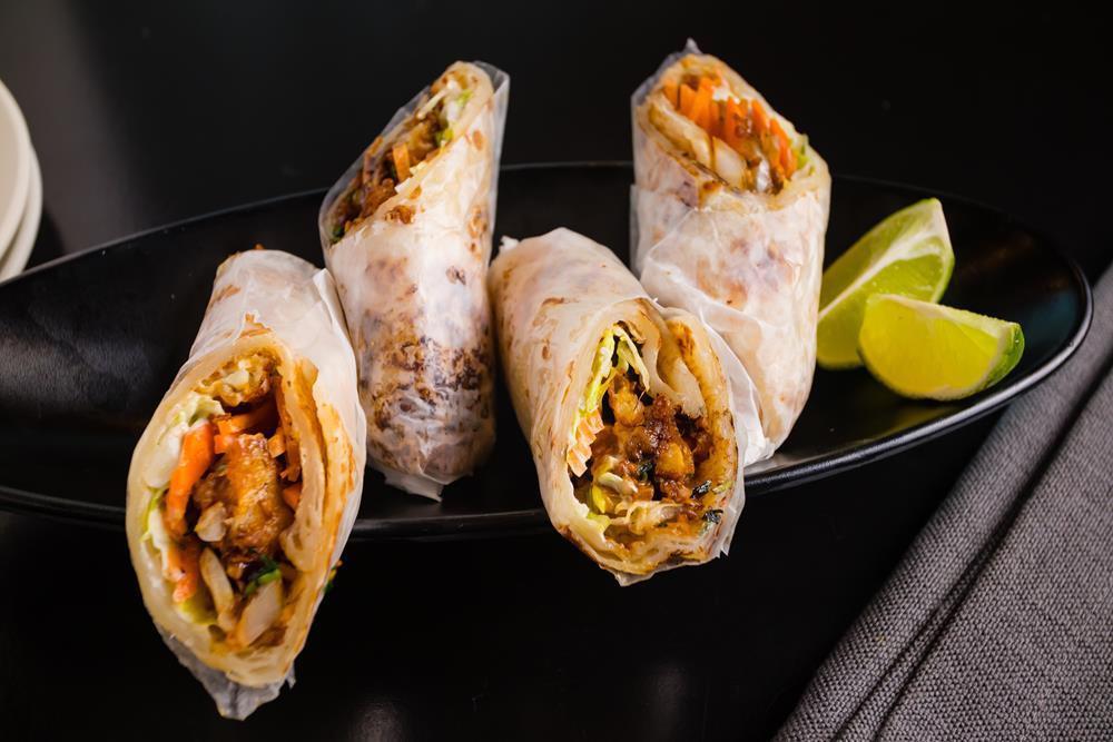 Tangra Masala Gobi Wraps · Crispy and buttery Roti stuffed with fresh Cauliflower and marinated with Szechuan spices.