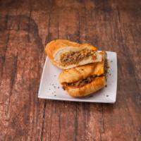 Cheesesteak Sandwich · It's not just for Philly anymore. Melted American cheese topping shaved steak and accompanie...