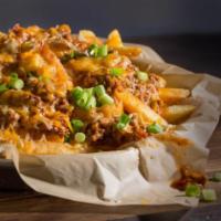 Chili Cheese Fries · Our traditional french fries topped with chili. Cheddar Jack cheese and fresh scallions. Thi...