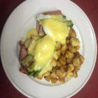 Prosciutto Benedict · Poached eggs, prosciutto and asparagus on toasted English muffin with Hollandaise sauce.